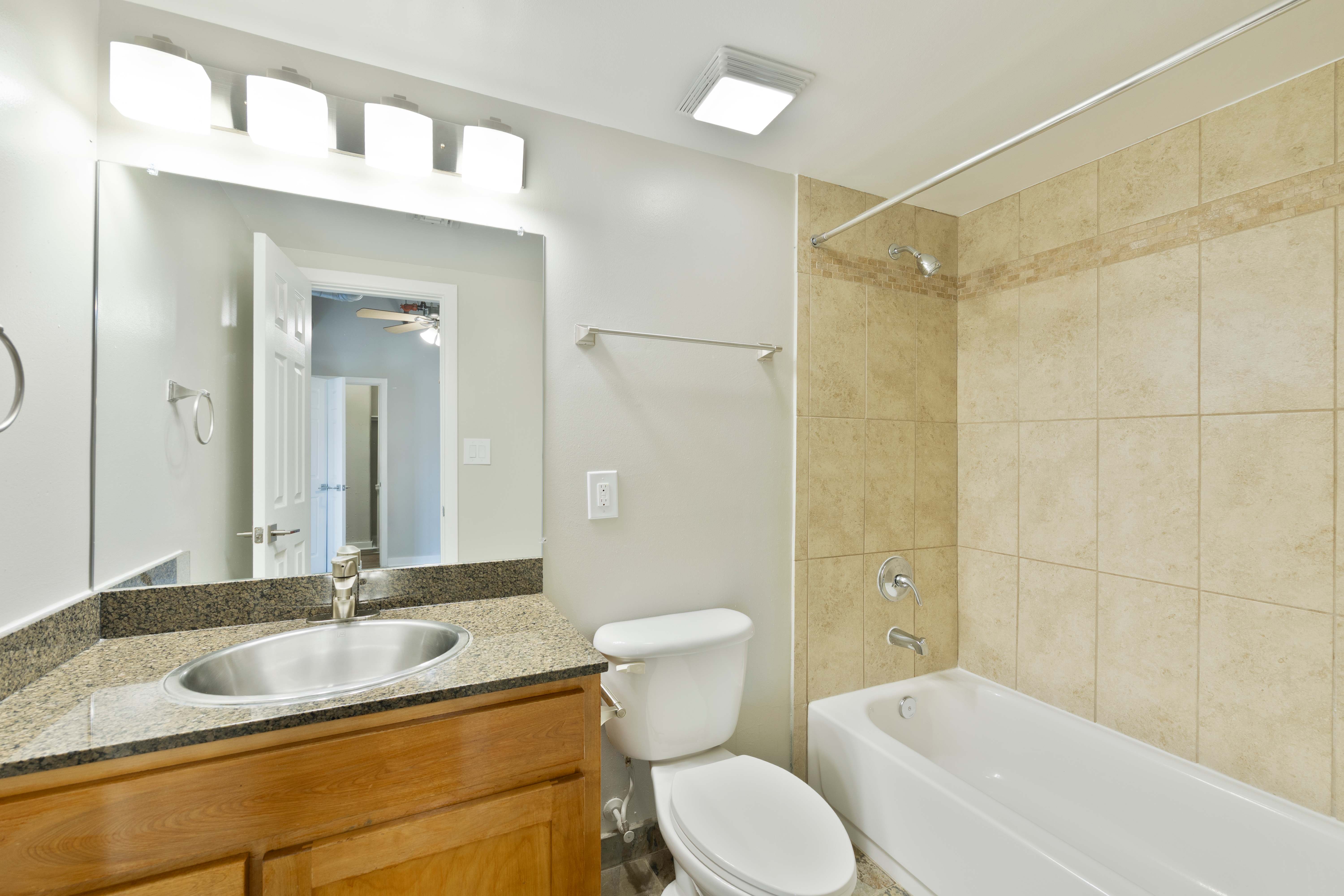Bathroom with wood cabinets