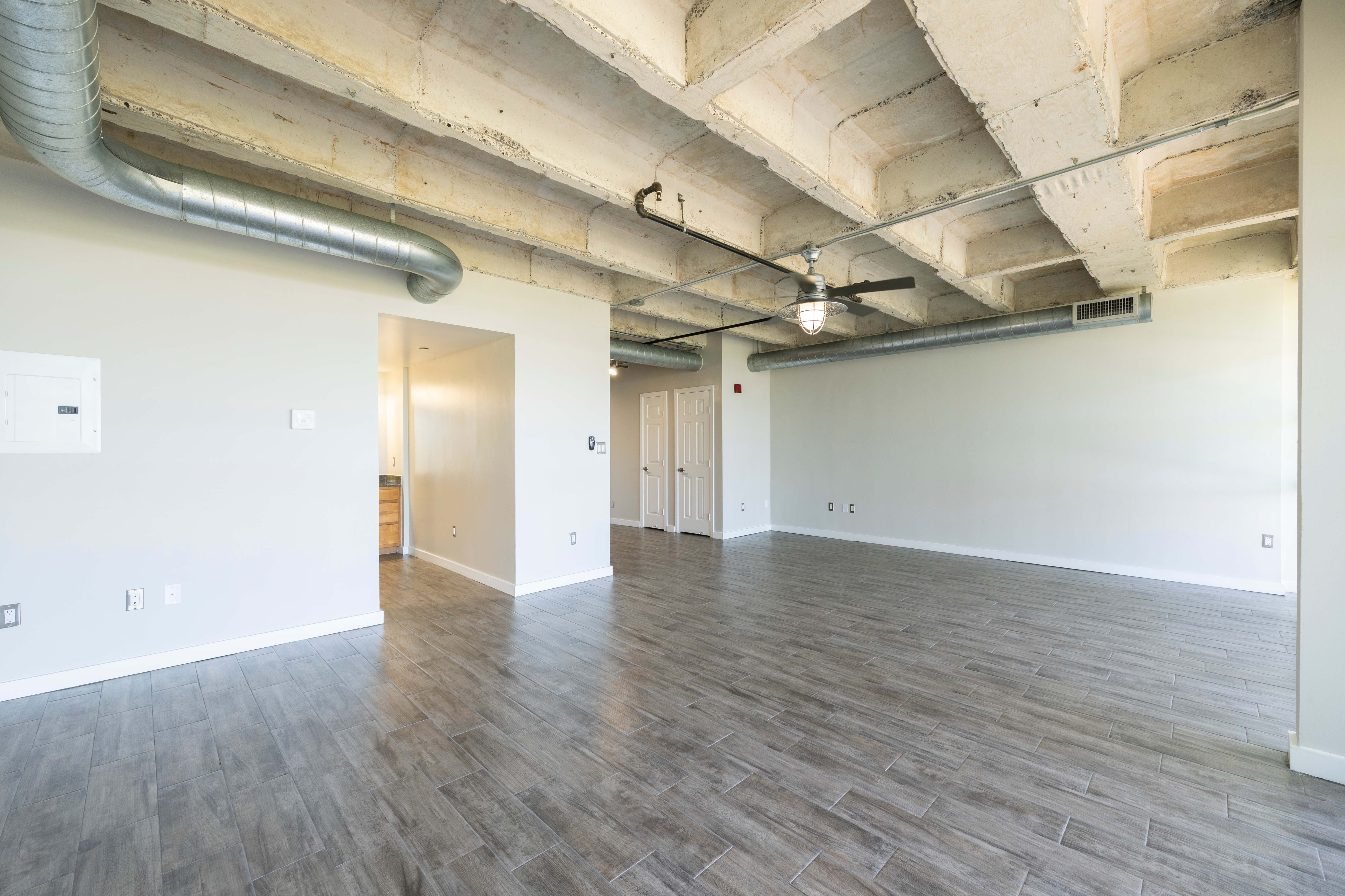 Living room with exposed ceiling